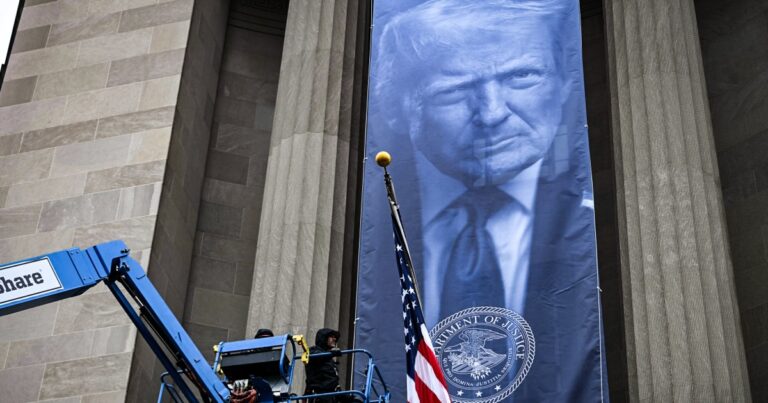 Trump banner unfurled at DOJ headquarters